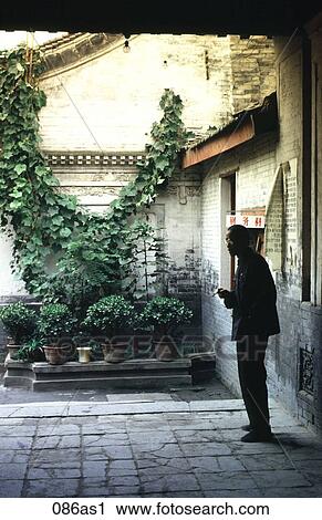 Man Smoking in Doorway Beside Planted Pots Xian Beijing View Large Photo Image Stock Image - Man Smoking in Doorway Beside Planted Pots Xian Beijing. Fotosearch