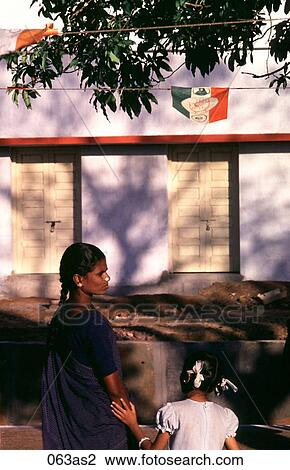 Stock Image - Woman and Girl on Train Platform India Asia. Fotosearch