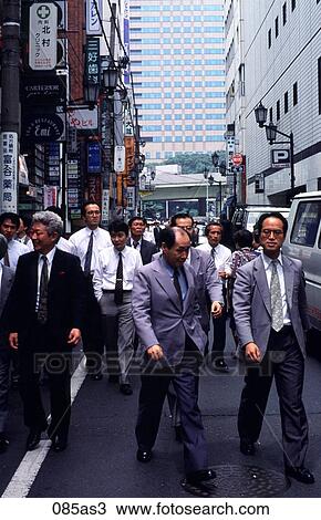 Stock Image - Executives in Street Tokyo Japan Asia. Fotosearch