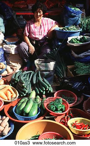 Stock Image - Woman Selling Vegetables Seoul Korea Asia. Fotosearch