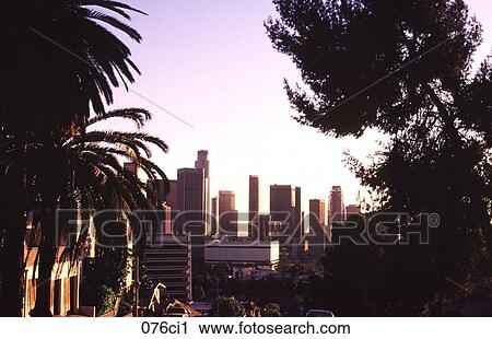 Stock Image - Sunset over Skyscrapers in Downtown Los Angeles USA. Fotosearch