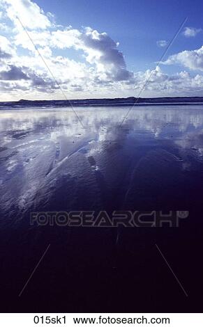Stock Image - Clouds Reflecting in Sea. Fotosearch