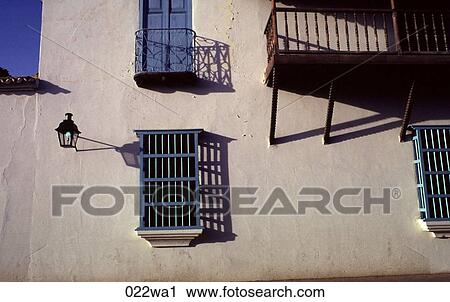 Stock Image - Blue Windows in White Wall Venezuela. Fotosearch
