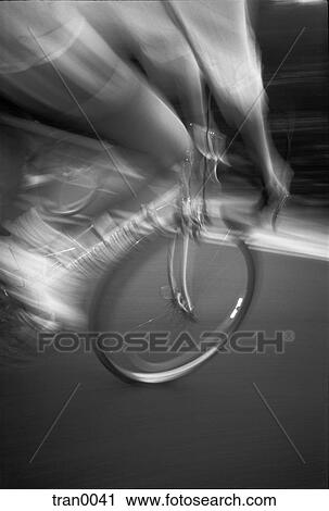 Stock Image - bicycle, black&white, blur, blurred, city street, crossing, motion. Fotosearch