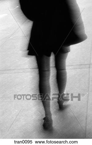 black and white photo, black skirt, blurred image, city, legs, pedestrian, sidewalk View Large Photo Image Stock Photography - black and white photo, black skirt, blurred image, city, legs, pedestrian, sidewalk. Fotosearch