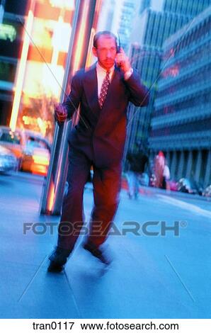 businessman, ambitious, business suit, business, buildings, calling, aggresive View Large Photo Image Stock Photo - businessman, ambitious, business suit, business, buildings, calling, aggresive. Fotosearch