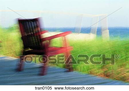 Stock Photography - casual, chair, day time, deck, fence, grass, holiday. Fotosearch