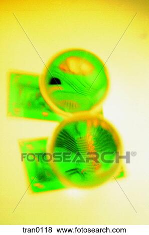 Stock Photo - circuit boards, clear, electronics, globes, high tech, magnifying. Fotosearch
