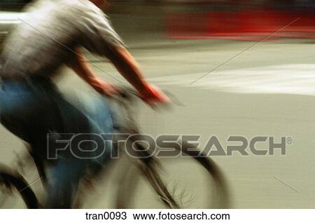 Stock Image - city, bicycle, bike riding, bike, bicyling, cruising, arms. Fotosearch
