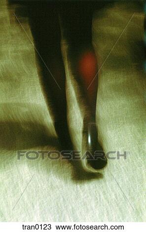 Stock Image - city, departing, legs, New York City, NYC, shoes, sidewalk. Fotosearch