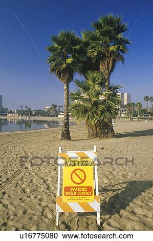 Stock Image - A beach closed warning sign. Fotosearch