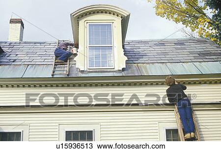 A couple on ladders painting their home View Large Photo Image Stock Image - A couple on ladders painting their home. Fotosearch