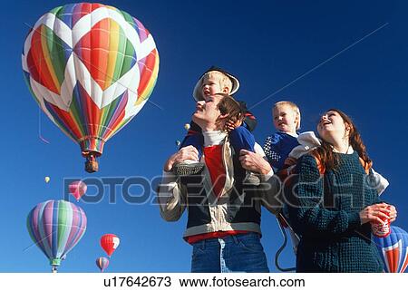 Stock Image - A family enjoying the Albequerque Hot Air Balloon Festival, NM. Fotosearch