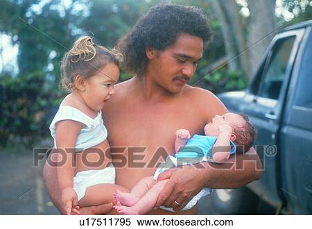 A Hawaiian father holding his two babies View Large Photo Image Stock Photography - A Hawaiian father holding his two babies. Fotosearch