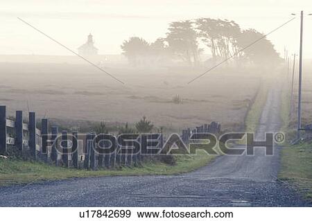 Stock Photo - A lighthouse in the fog in Mendocino, California. Fotosearch