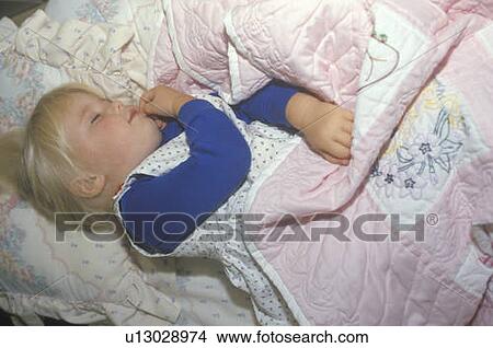 Picture - A little girl napping. Fotosearch