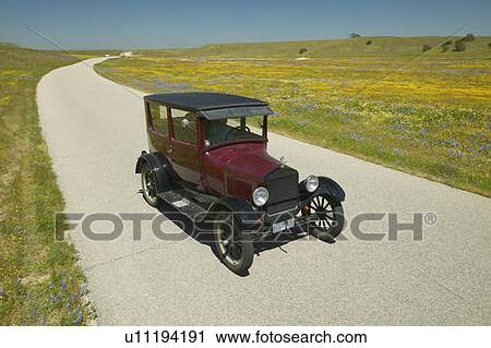 A maroon Model T driving down a scenic road View Large Photo Image Stock Image - A maroon Model T driving down a scenic road. Fotosearch