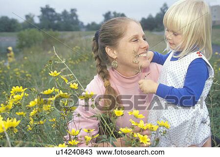 Stock Image - A mother and daughter in wildflowers. Fotosearch