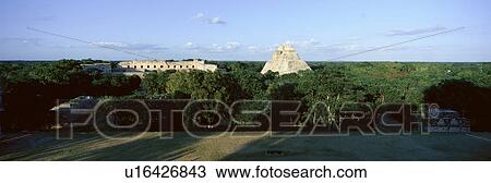 Stock Image - A panoramic view from left to right: Nunnery Quadrangle and the Pyramid of the Magician. Fotosearch