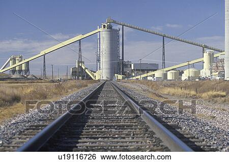 Stock Photograph - A railroad leading towards geothermal power plant. Fotosearch