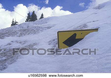 A road sign covered by snow View Large Photo Image Stock Photo - A road sign covered by snow. Fotosearch