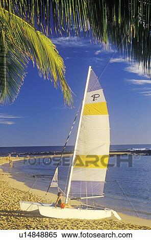 A sailboat launched on the beach of Hanapepe Bay in Kauai, Hawaii View Large Photo Image Stock Photography - A sailboat launched on the beach of Hanapepe Bay in Kauai, Hawaii. Fotosearch