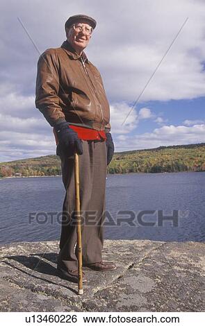 A senior citizen on his morning walk View Large Photo Image Stock Photograph - A senior citizen on his morning walk. Fotosearch