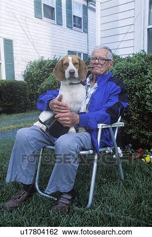 A senior citizen with his hound dog View Large Photo Image Stock Image - A senior citizen with his hound dog. Fotosearch