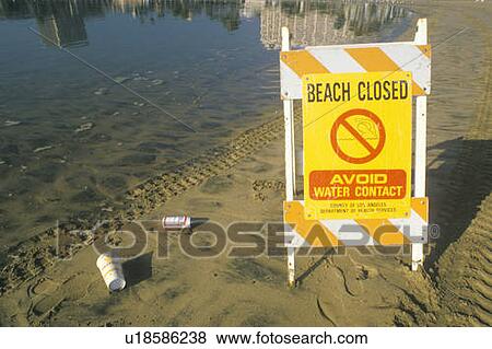 Stock Photo - A sign that reads “Beach Closed”. Fotosearch