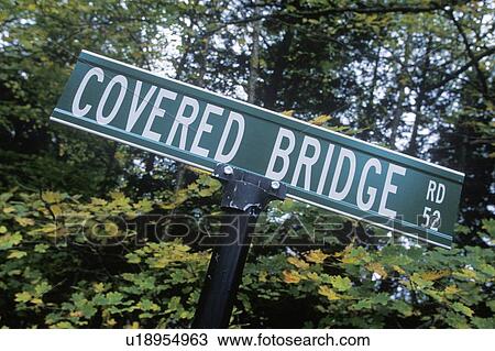Stock Image - A sign that reads “Covered Bridge Rd”. Fotosearch