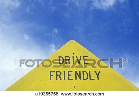 Stock Photograph - A sign that reads “Drive Friendly”. Fotosearch