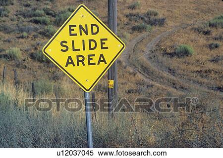 Stock Photography - A sign that reads “End slide area”. Fotosearch
