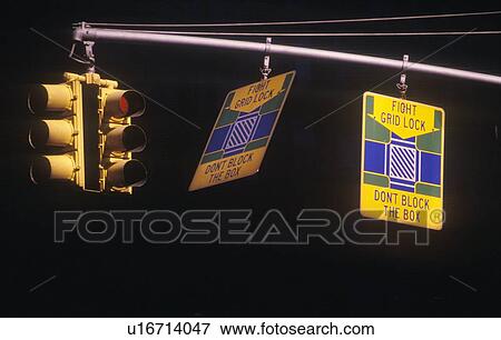 A sign that reads “Fight gridlock - don't block the box” View Large Photo Image Stock Photo - A sign that reads “Fight gridlock - don't block the box”. Fotosearch