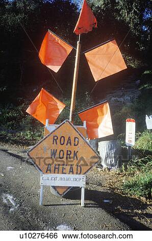 Stock Photograph - A sign that reads “Road work ahead”. Fotosearch