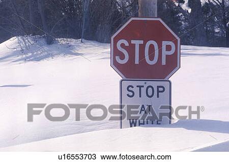 Stock Image - A sign that reads “Stop, stop at white line”. Fotosearch