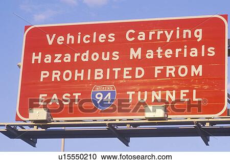 Stock Image - A sign that reads “Vehicles carrying hazardous materials prohibited”. Fotosearch