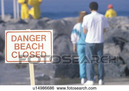 A sign warning, danger–beach closed with people in the background View Large Photo Image Stock Photograph - A sign warning, danger–beach closed with people in the background. Fotosearch