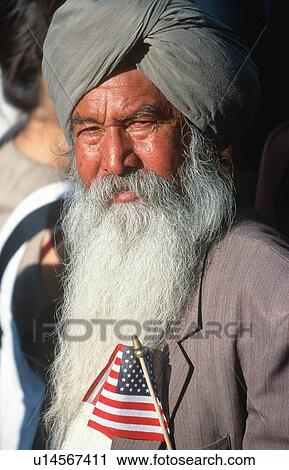 A Sikh Indian-American holding a tiny American flag View Large Photo Image Stock Image - A Sikh Indian-American holding a tiny American flag. Fotosearch
