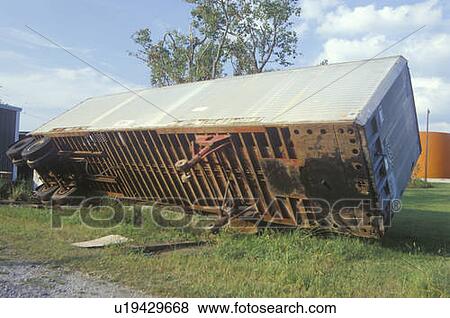 A tractor trailer turned on its side during Hurricane Andrew View Large Photo Image Stock Photo - A tractor trailer turned on its side during Hurricane Andrew. Fotosearch