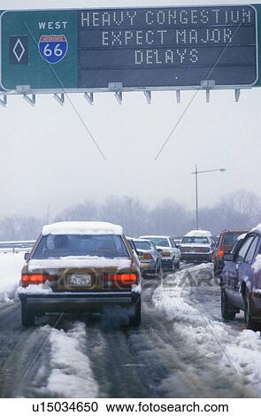 Stock Image - A winter storm warning on Route 66 in Washington D. C.. Fotosearch