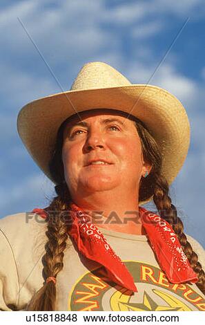 A woman wearing braids and straw hat View Large Photo Image Stock Photo - A woman wearing braids and straw hat. Fotosearch