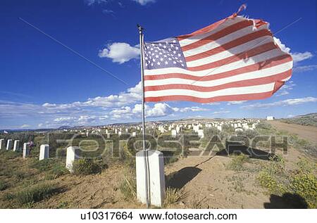 Picture - American flag at the Navaho cemetery, Fort Defiance, AZ. Fotosearch