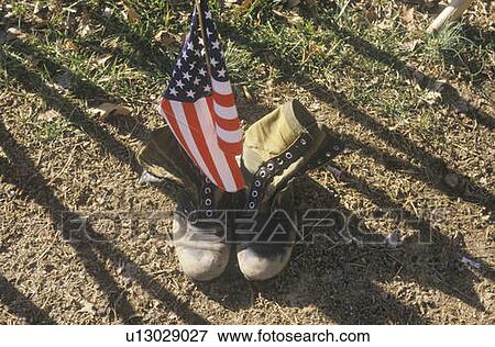 Stock Photo - American Flag Between Two Army Boots. Fotosearch