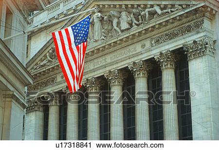 Stock Image - American flag flying at New York Stock Exchange, New York. Fotosearch
