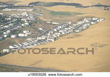An aerial view of a housing development and wheat field View Large Photo Image Stock Photograph - An aerial view of a housing development and wheat field. Fotosearch