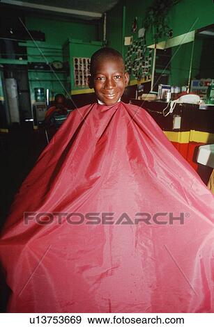 An African-American boy in a barber's chair View Large Photo Image Stock Photo - An African-American boy in a barber's chair. Fotosearch