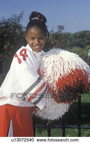 Stock Image - An African-American cheerleader. Fotosearch