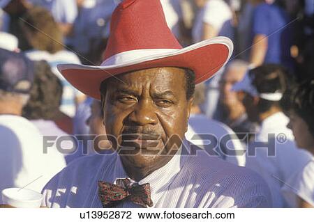 An African-American man at the U. S. Senior Olympics wearing a red cowboy hat View Large Photo Image Stock Image - An African-American man at the U. S. Senior Olympics wearing a red cowboy hat. Fotosearch
