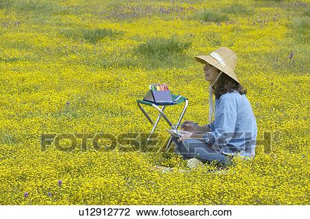 An artist sketching spring flower fields View Large Photo Image Stock Image - An artist sketching spring flower fields. Fotosearch