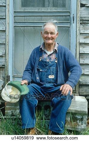 Stock Photo - An retiree on his front steps. Fotosearch